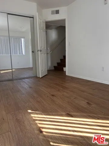wooden floor in a hall with an entryway