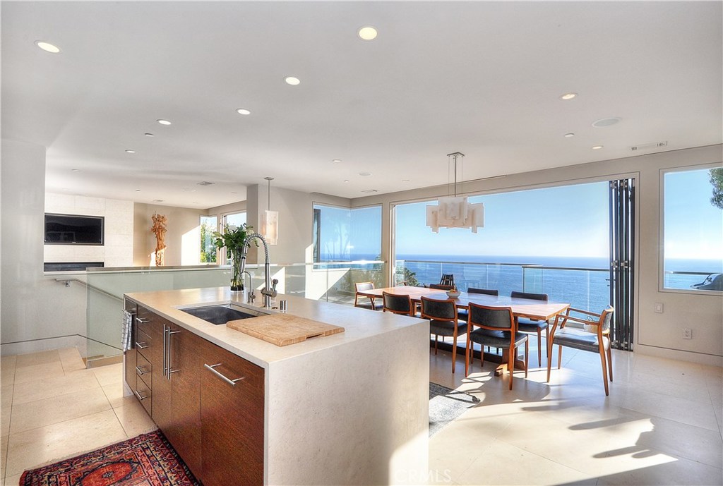 a kitchen with lots of counter top space and living room