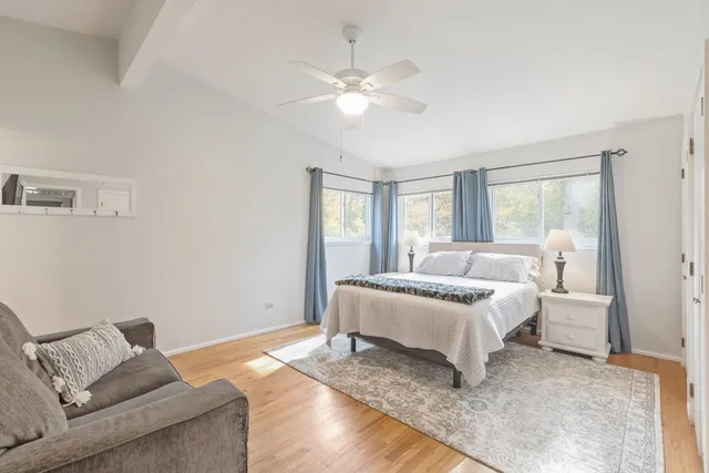 a bedroom with a bed and a couch