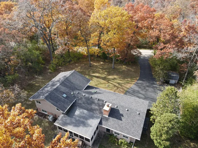 an aerial view of residential house with outdoor space