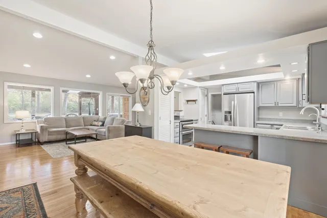 a large room with lots of counter space and windows