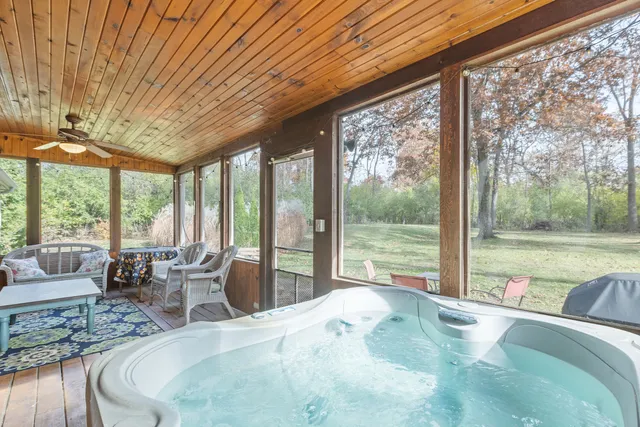 a bed room with a bed and glass windows