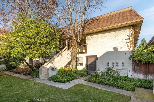 a front view of house with garden