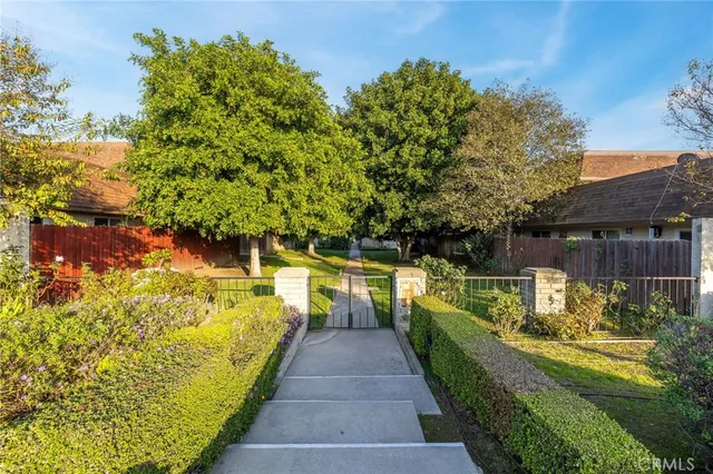 a swimming pool with wooden fence