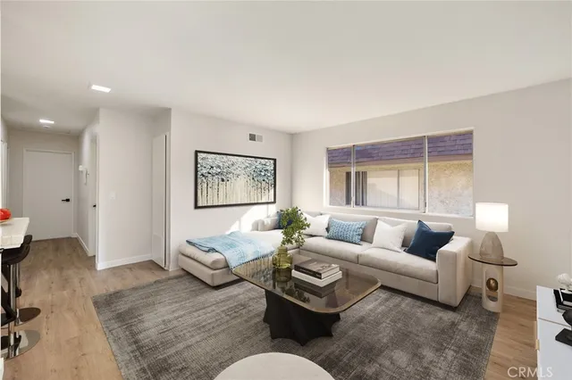 a living room with furniture and a large window