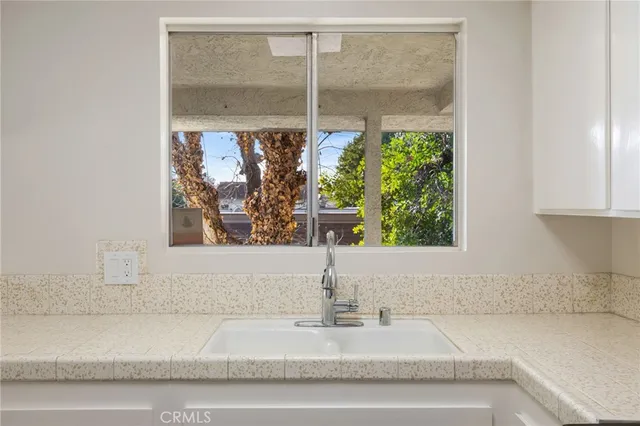 a bathroom with a bathtub and a window