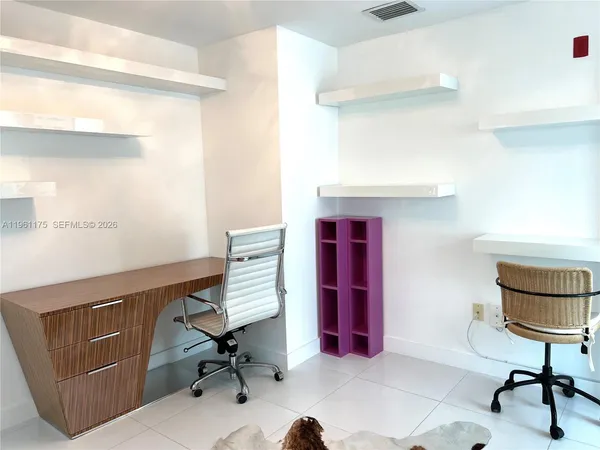 a room with furniture and a window