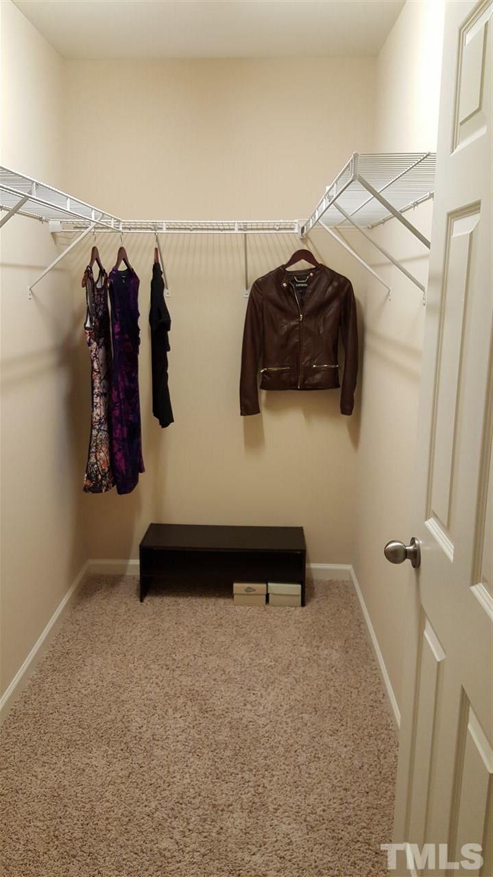408 Stone Flower Lane Raleigh, NC 27603 - Photo 11 of 20 Second closet measures approximately 8' by 4'.