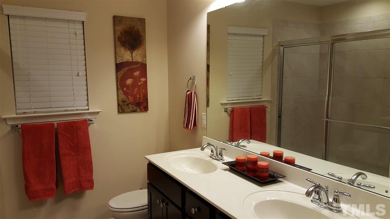 408 Stone Flower Lane Raleigh, NC 27603 - Photo 9 of 20 Double vanity with large tile shower and linen closet