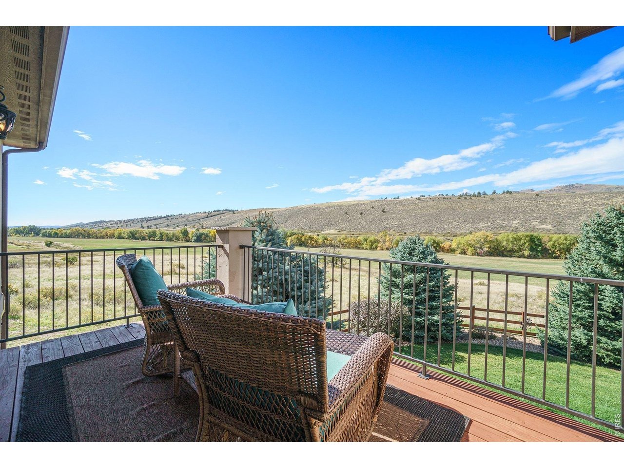10723 Buckhorn Ridge Way Loveland, CO 80538 - Photo 23 of 50 a view of a balcony with lake view and a ocean view
