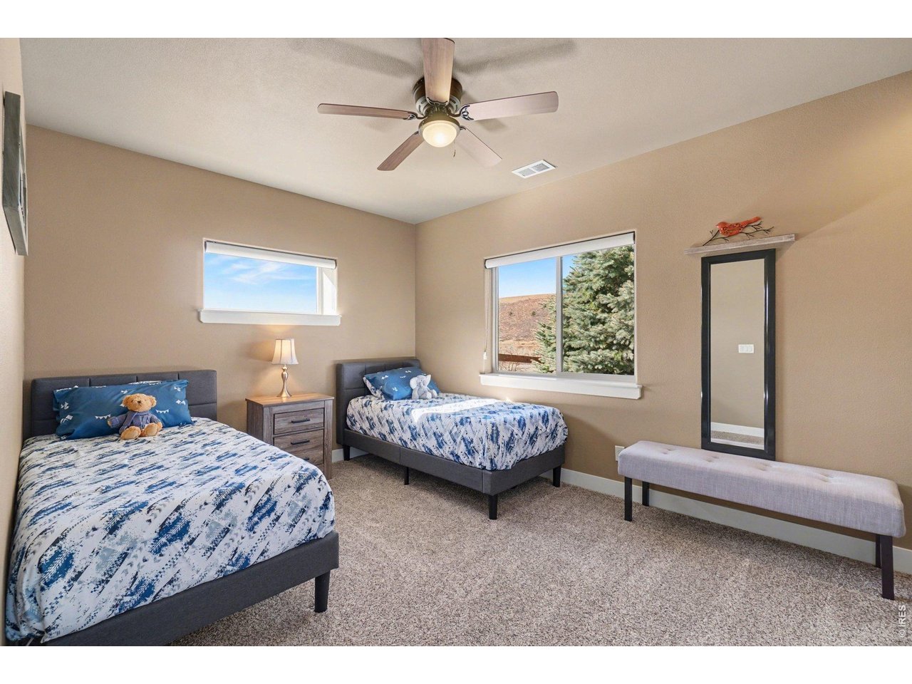 10723 Buckhorn Ridge Way Loveland, CO 80538 - Photo 25 of 50 a bedroom with a bed and a couch