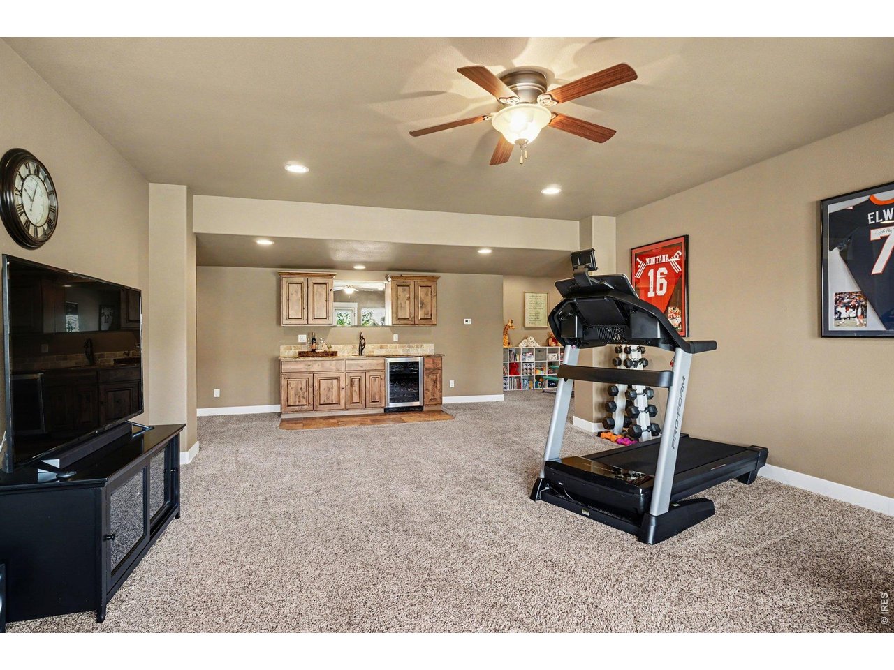 10723 Buckhorn Ridge Way Loveland, CO 80538 - Photo 28 of 50 a living room with furniture and a flat screen tv