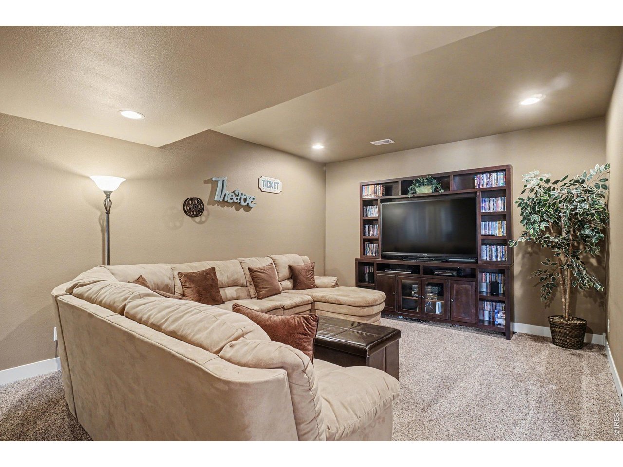 10723 Buckhorn Ridge Way Loveland, CO 80538 - Photo 31 of 50 a living room with furniture and a flat screen tv