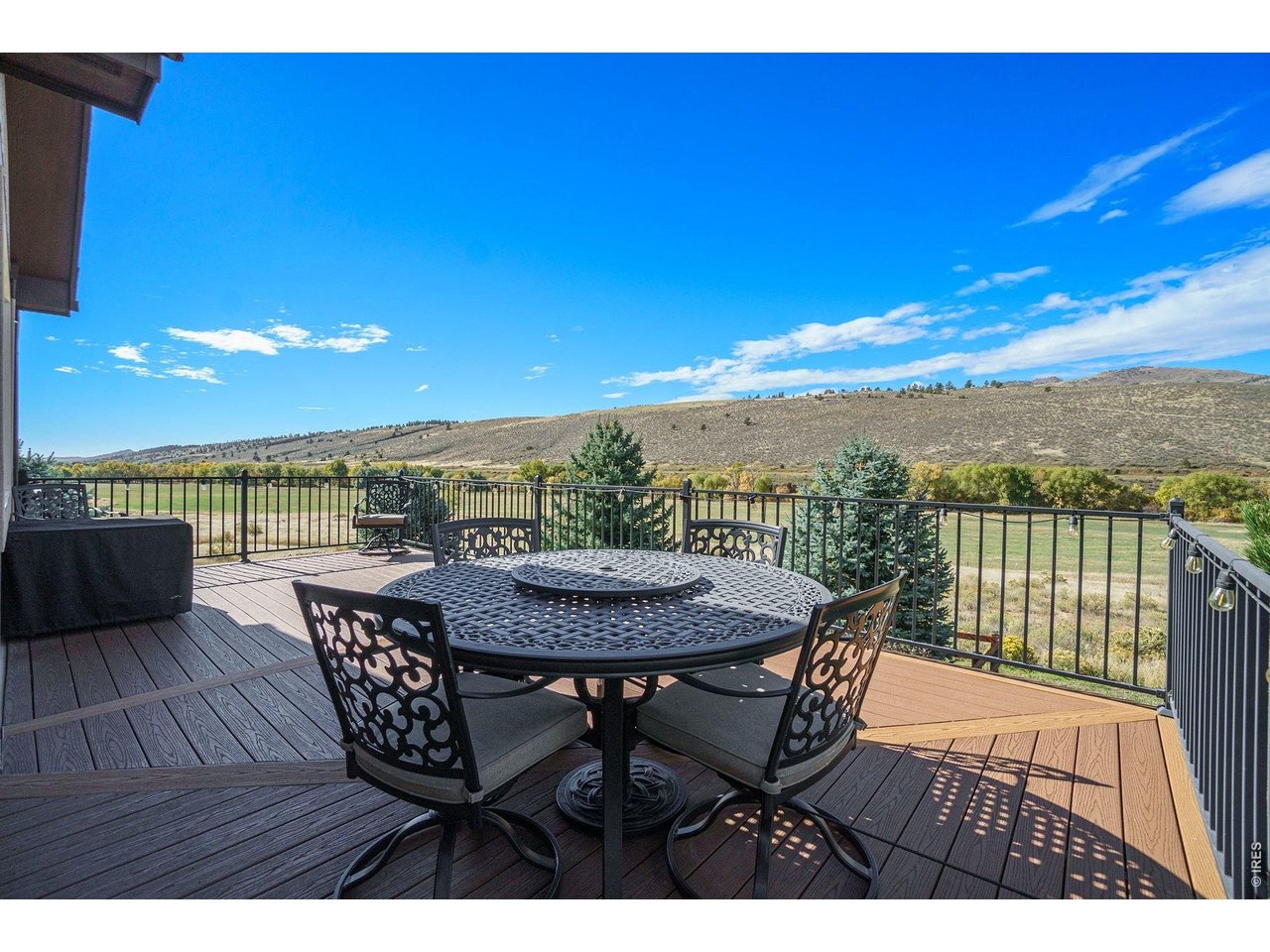 10723 Buckhorn Ridge Way Loveland, CO 80538 - Photo 37 of 50 a view of a terrace with furniture