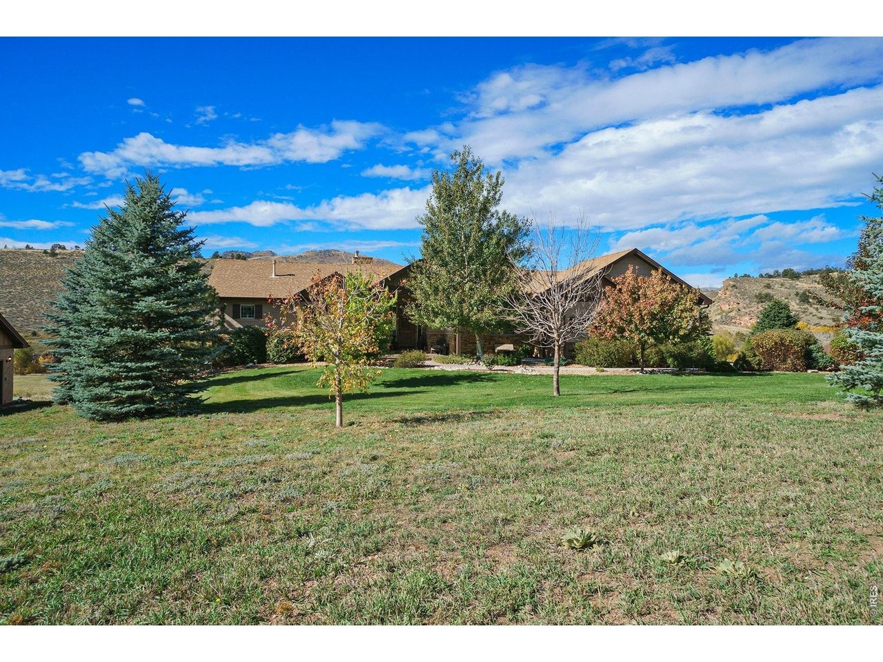 10723 Buckhorn Ridge Way Loveland, CO 80538 - Photo 4 of 50 a view of a field with a house