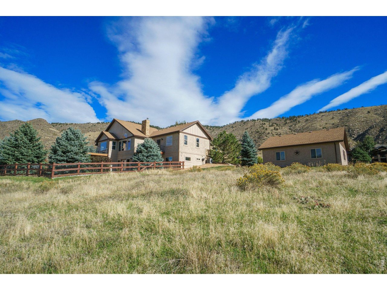 10723 Buckhorn Ridge Way Loveland, CO 80538 - Photo 44 of 50 a house view with a yard