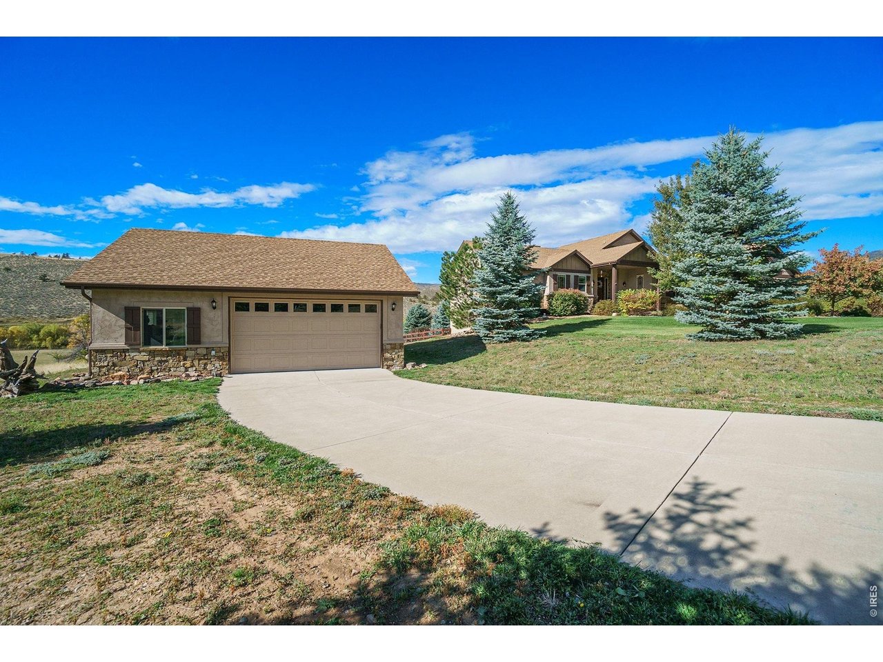 10723 Buckhorn Ridge Way Loveland, CO 80538 - Photo 5 of 50 a view of a house with a yard