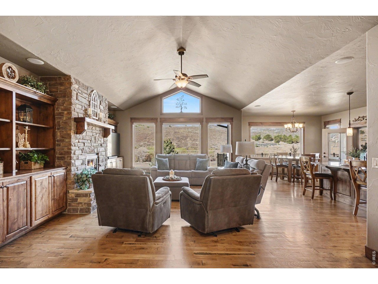 10723 Buckhorn Ridge Way Loveland, CO 80538 - Photo 6 of 50 a living room with furniture large window and plants