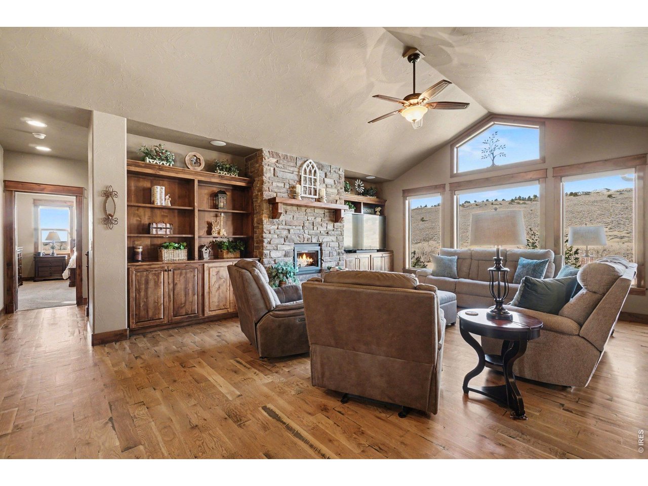 10723 Buckhorn Ridge Way Loveland, CO 80538 - Photo 8 of 50 a living room with furniture and a large window