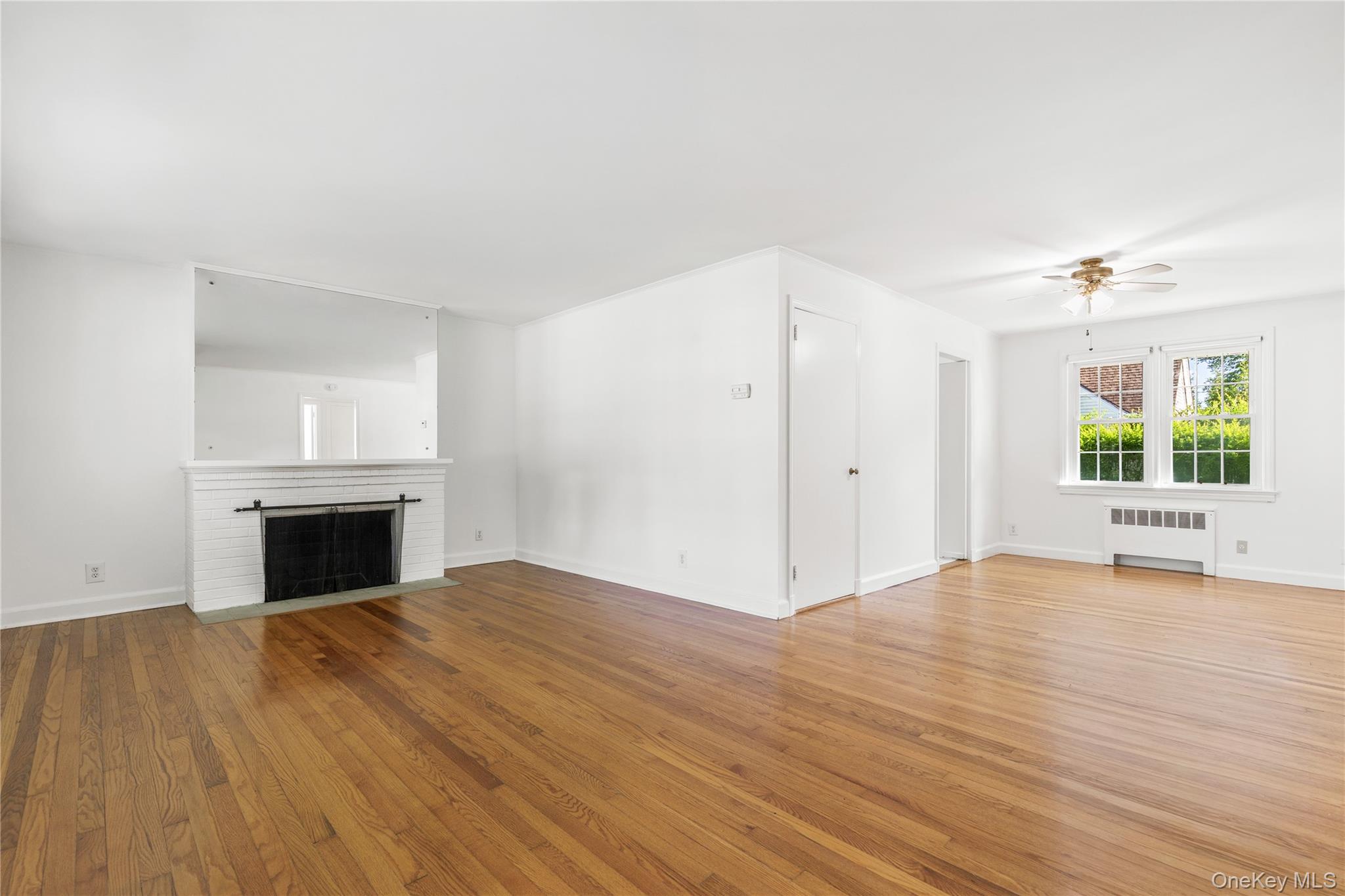 2 Argyle Road Rye Brook, NY 10573 - Photo 2 of 22 living room with fpl and dining area