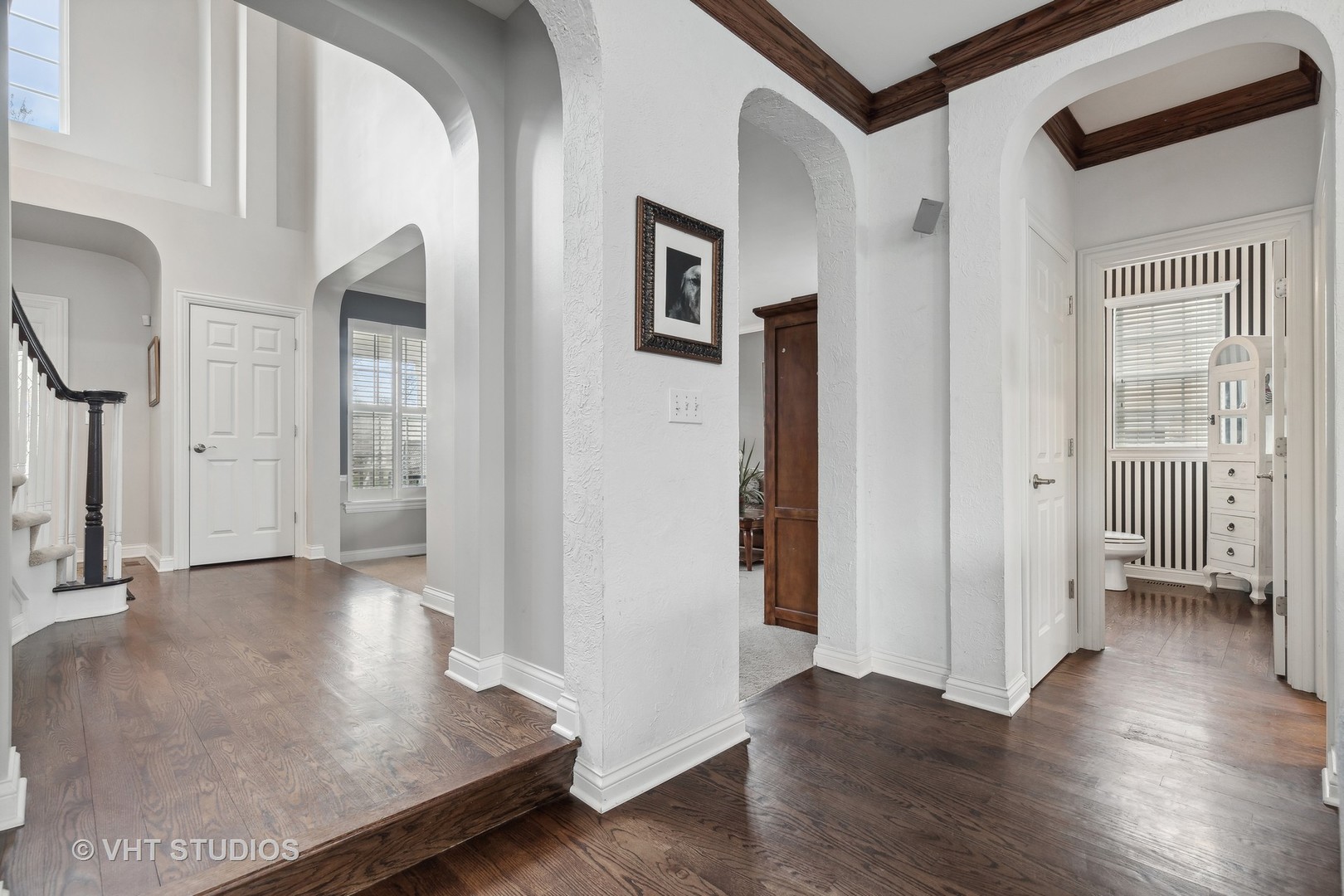 303 Saddle Lane Fox River Grove, IL 60021 - Photo 16 of 70 an entryway with wooden floor and windows