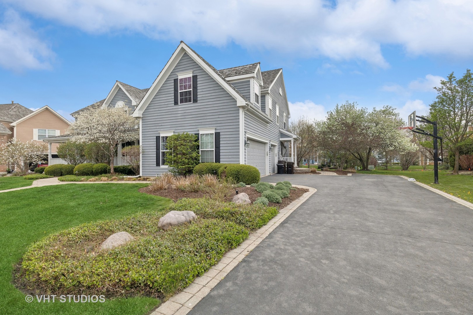 303 Saddle Lane Fox River Grove, IL 60021 - Photo 3 of 70 a front view of a house with garden