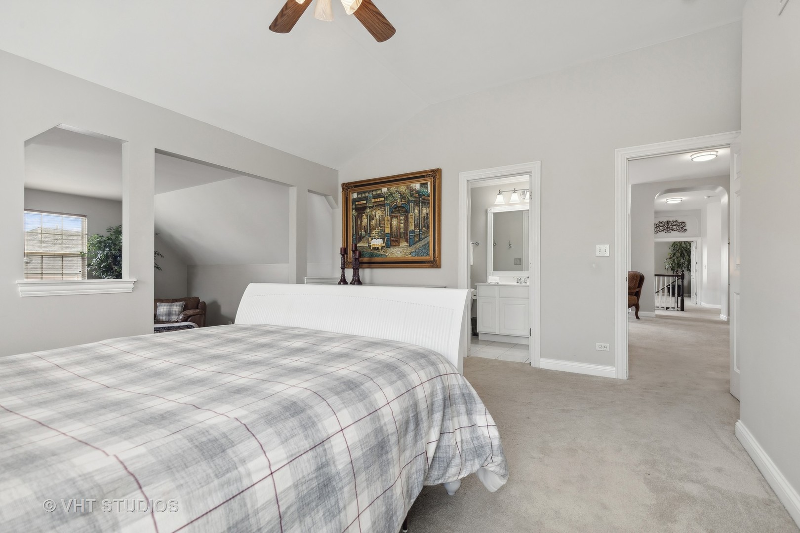 303 Saddle Lane Fox River Grove, IL 60021 - Photo 40 of 70 a spacious bedroom with a bed and a chandelier