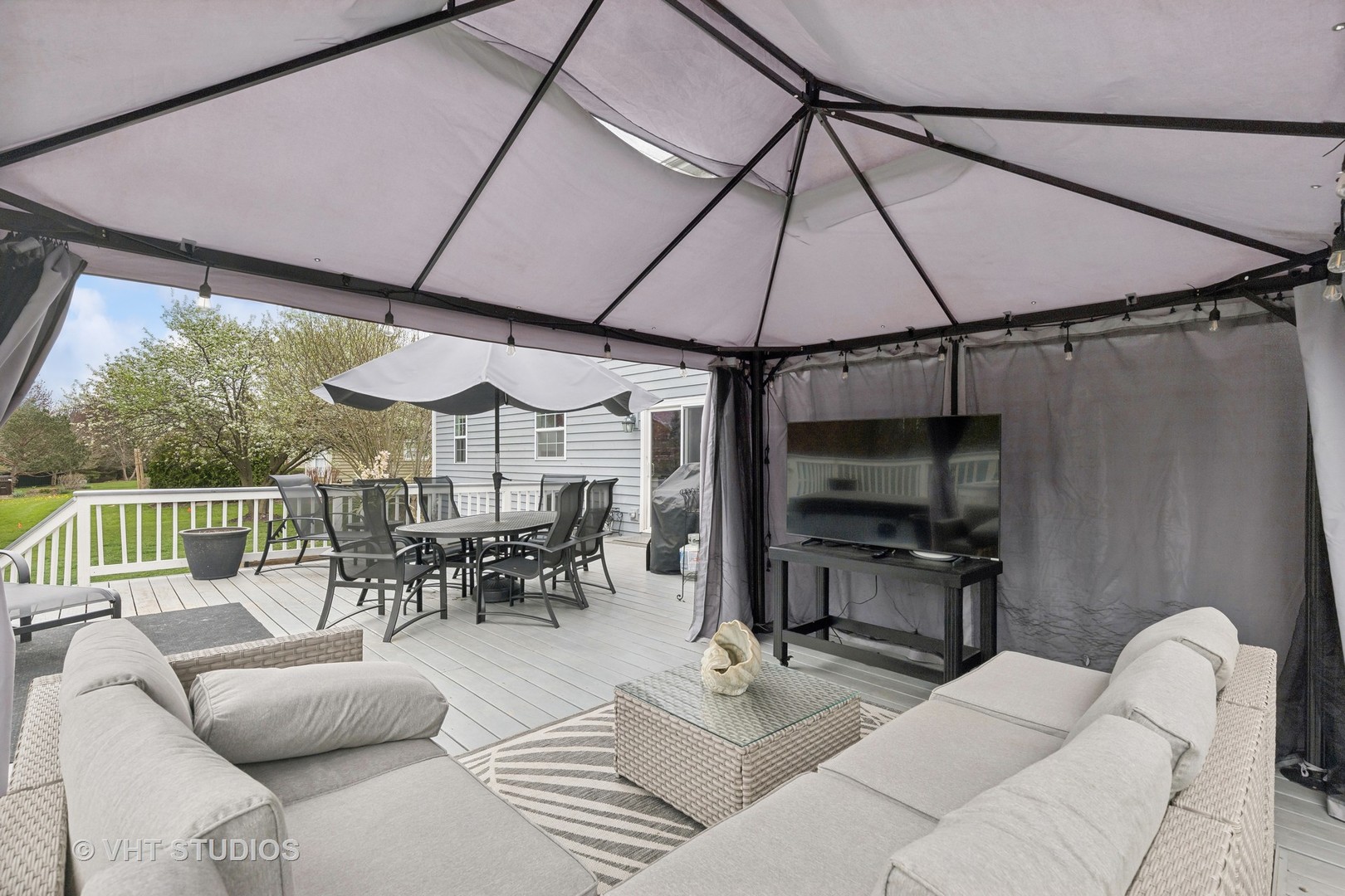 303 Saddle Lane Fox River Grove, IL 60021 - Photo 6 of 70 a living room with furniture a dining table and chairs