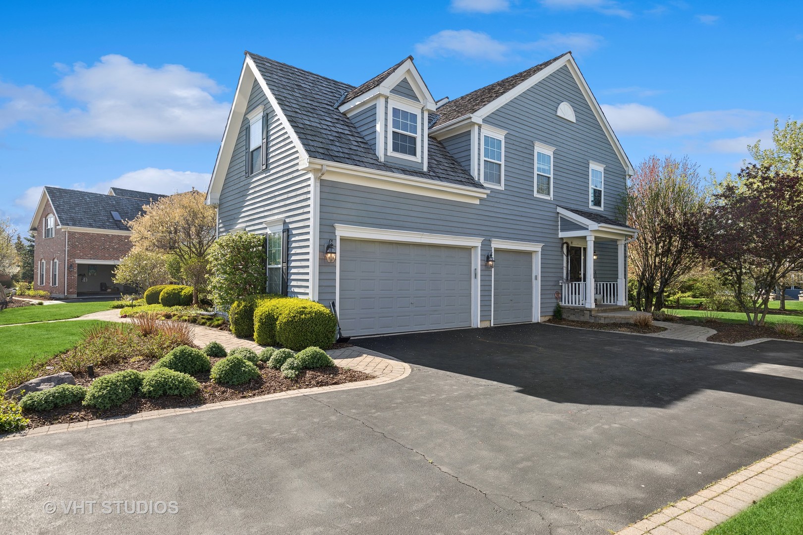 303 Saddle Lane Fox River Grove, IL 60021 - Photo 64 of 70 a front view of a house with garden