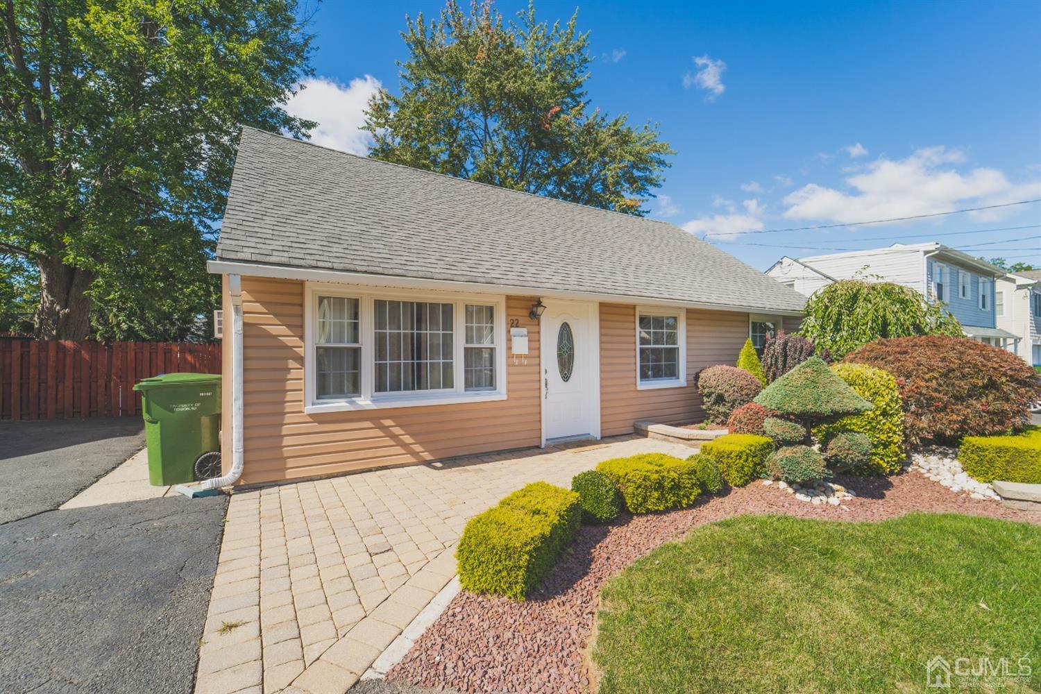 22 Richmond Road Edison, NJ 08817 - Photo 1 of 19 a front view of a house with a yard and outdoor seating