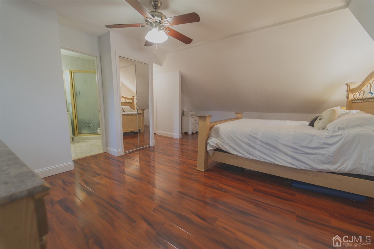 22 Richmond Road Edison, NJ 08817 - Photo 13 of 19 a bedroom with a bed and wooden floor
