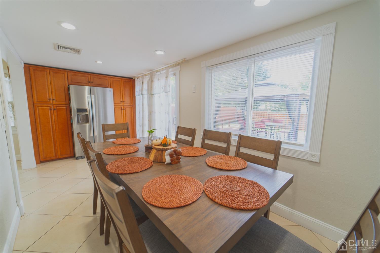 22 Richmond Road Edison, NJ 08817 - Photo 3 of 19 a view of a dining room with furniture window and outside view