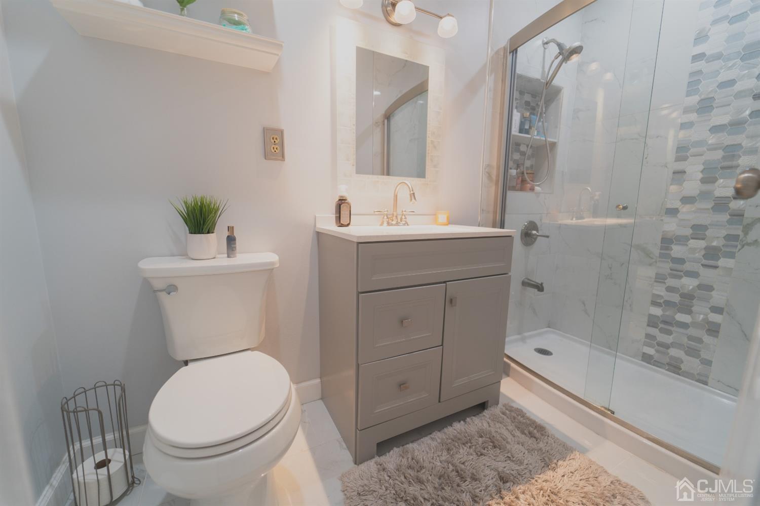 22 Richmond Road Edison, NJ 08817 - Photo 5 of 19 a bathroom with a sink a toilet and shower