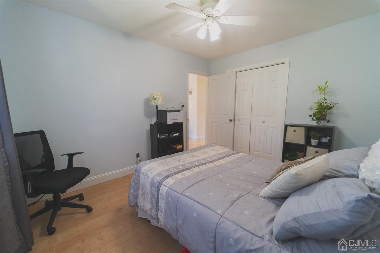 22 Richmond Road Edison, NJ 08817 - Photo 9 of 19 a bedroom with a bed and a chair