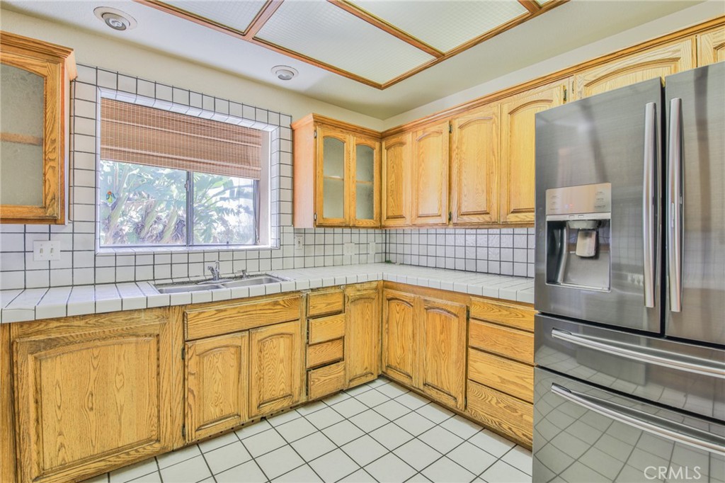 1707 Nabal Road La Habra Heights, CA 90631 - Photo 27 of 64 a view of a kitchen with granite countertop a sink and a refrigerator