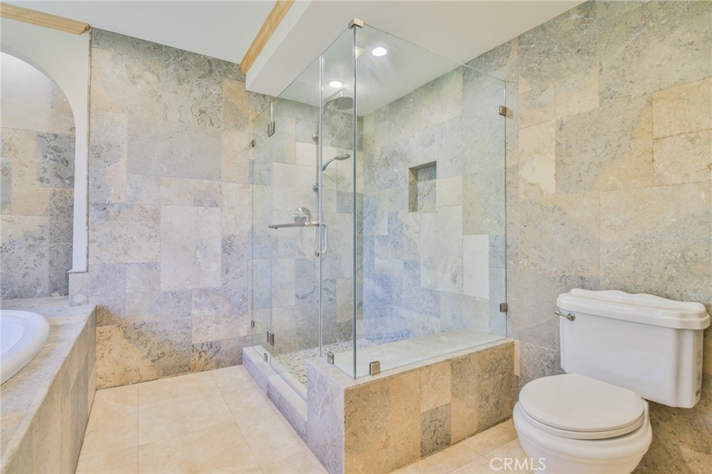 1707 Nabal Road La Habra Heights, CA 90631 - Photo 33 of 64 a bathroom with a bathtub and a toilet