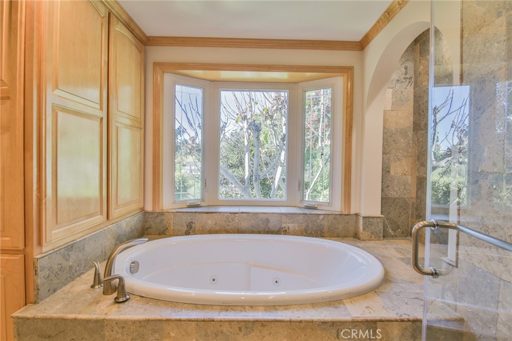 1707 Nabal Road La Habra Heights, CA 90631 - Photo 35 of 64 a white bath tub sitting in a bathroom next to a window