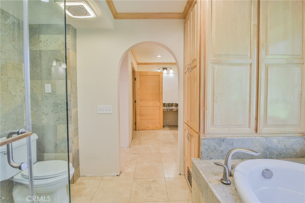 1707 Nabal Road La Habra Heights, CA 90631 - Photo 36 of 64 a bathroom with a granite countertop sink toilet and shower