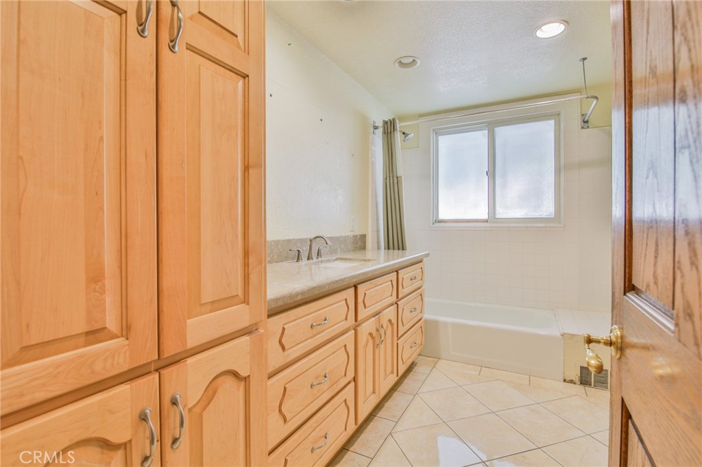 1707 Nabal Road La Habra Heights, CA 90631 - Photo 40 of 64 a spacious bathroom with a tub shower and sink