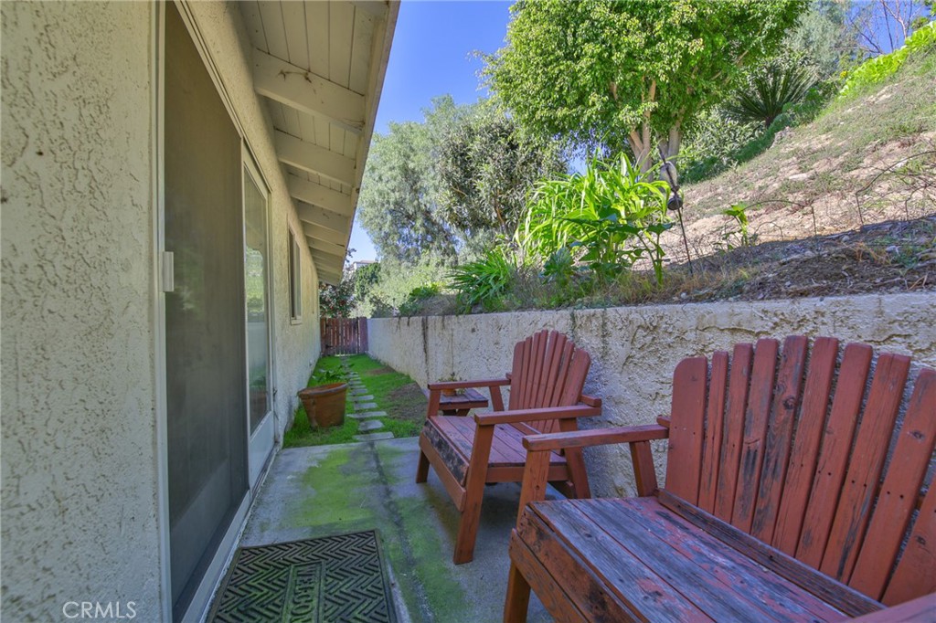 1707 Nabal Road La Habra Heights, CA 90631 - Photo 53 of 64 a view of balcony with wooden floor outdoor seating and yard in back