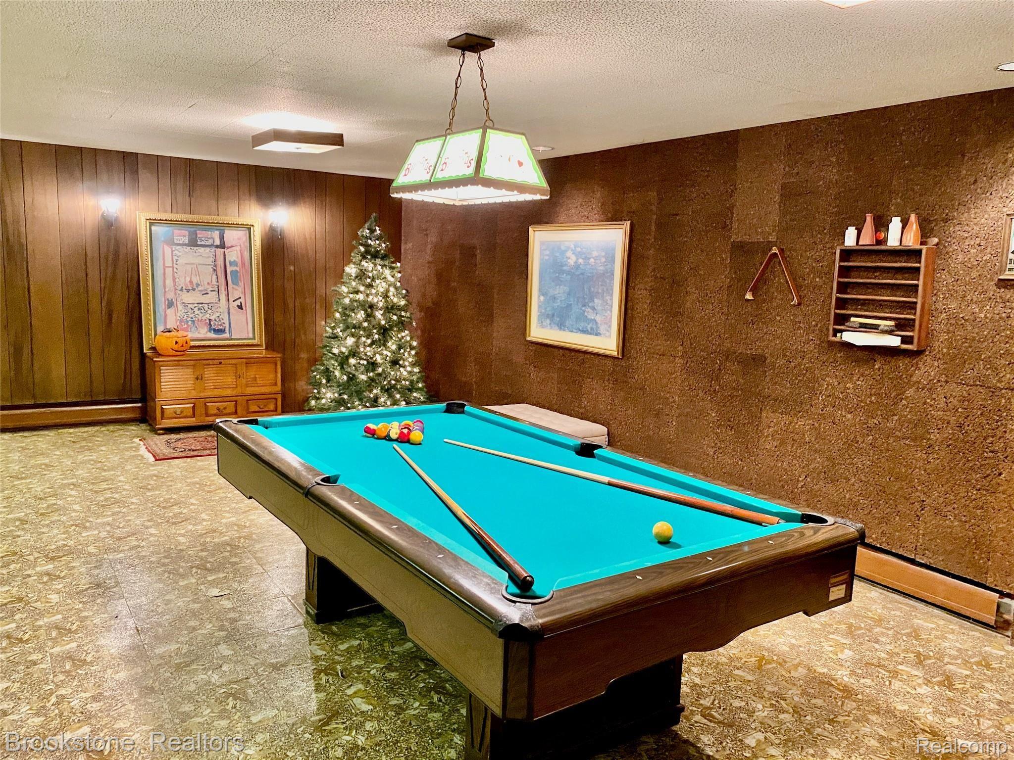 838 Wilwood Road Rochester, MI 48309 - Photo 49 of 53 IN MOST FINISHED BASEMENTS THERE IS NOT ENOUGH ROOM BETWEEN THE TABLE & WALLS TO PLAY A GOOD GAME OF POOL. THAT IS NOT THE CASE HERE!