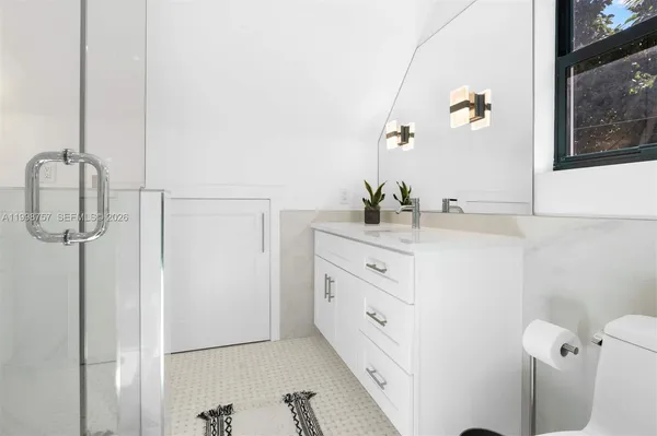 a bathroom with a sink and mirror