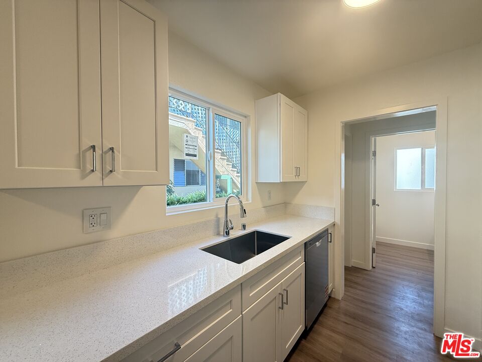 1314 10th Street, Unit A Santa Monica, CA 90401 - Photo 20 of 53 a kitchen that has a sink and a stove in it