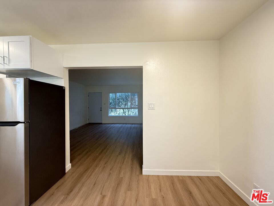 1314 10th Street, Unit A Santa Monica, CA 90401 - Photo 24 of 53 a view of a hallway with wooden floor and closet