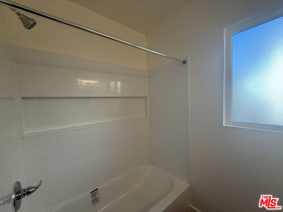 1314 10th Street, Unit A Santa Monica, CA 90401 - Photo 28 of 53 a bathroom with a shower