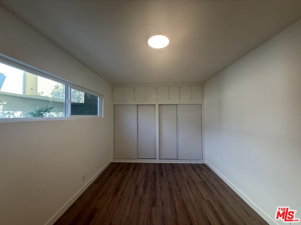 1314 10th Street, Unit A Santa Monica, CA 90401 - Photo 30 of 53 a view of a room with wooden floor