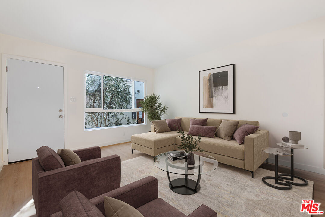 1314 10th Street, Unit A Santa Monica, CA 90401 - Photo 3 of 53 a living room with furniture and a window