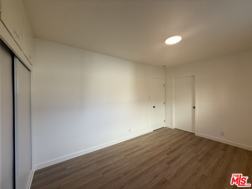 1314 10th Street, Unit A Santa Monica, CA 90401 - Photo 34 of 53 a view of a room with wooden floor