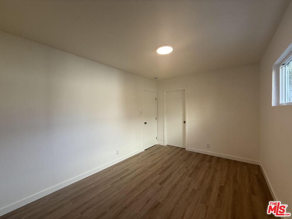 1314 10th Street, Unit A Santa Monica, CA 90401 - Photo 35 of 53 a view of wooden floor and brick walls