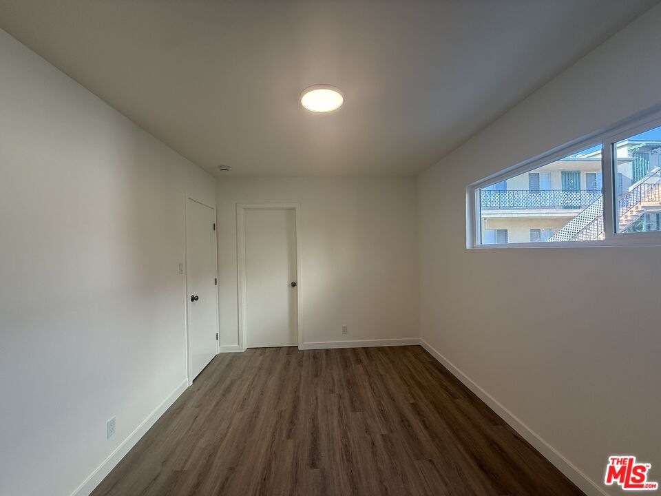 1314 10th Street, Unit A Santa Monica, CA 90401 - Photo 36 of 53 a view of room with window and hardwood floor